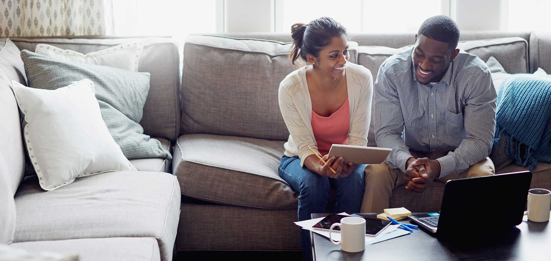 Young couple applying for a mortgage loan.